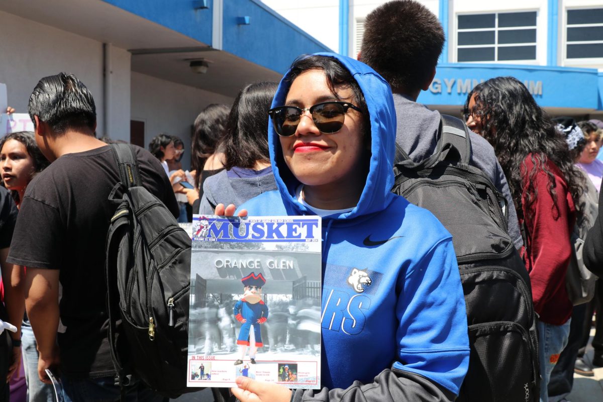 Hot off the Press! Social Science teacher Mellany Morales shows of her claimed copy of the Musket Newsmagazine. 