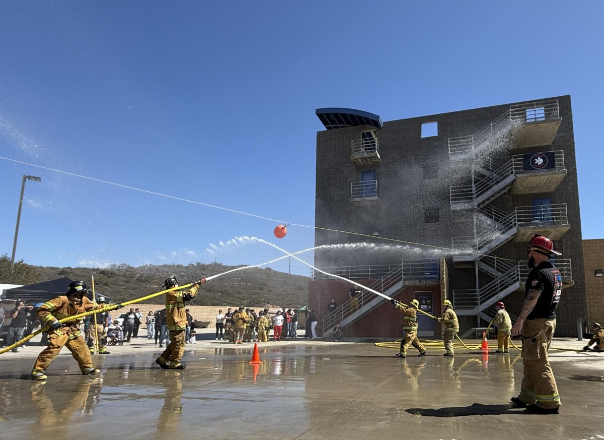 Spray back! The 1904 Cadets spray down Lincoln High School, sending them retreating in the Water Wars competition.