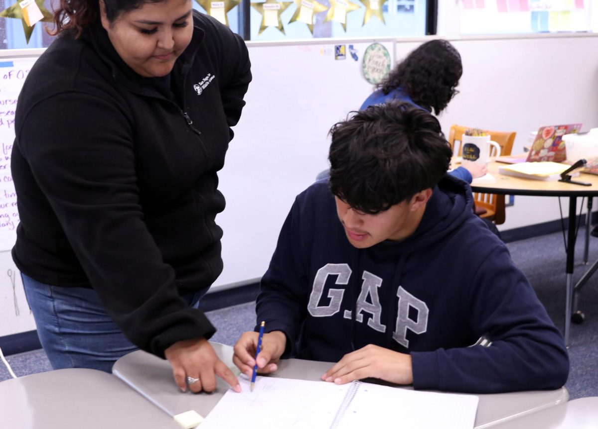 Learn by doing. Avid tutor Alejandra Cazares is helping students of AVID with all kinds of subjects in order to help them succeed in their academics “It's really rewarding to kind of see them go through from freshmen year to their senior years to see the issues that they've kind of surpassed,” Cazares, said.
