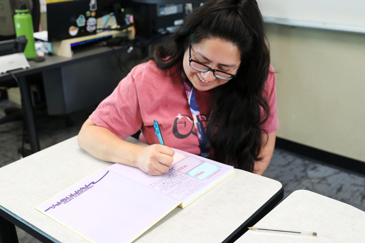 Teacher Luz Clartia Torres writing her final goodbyes to her students from 2022-2023 graduating students.
