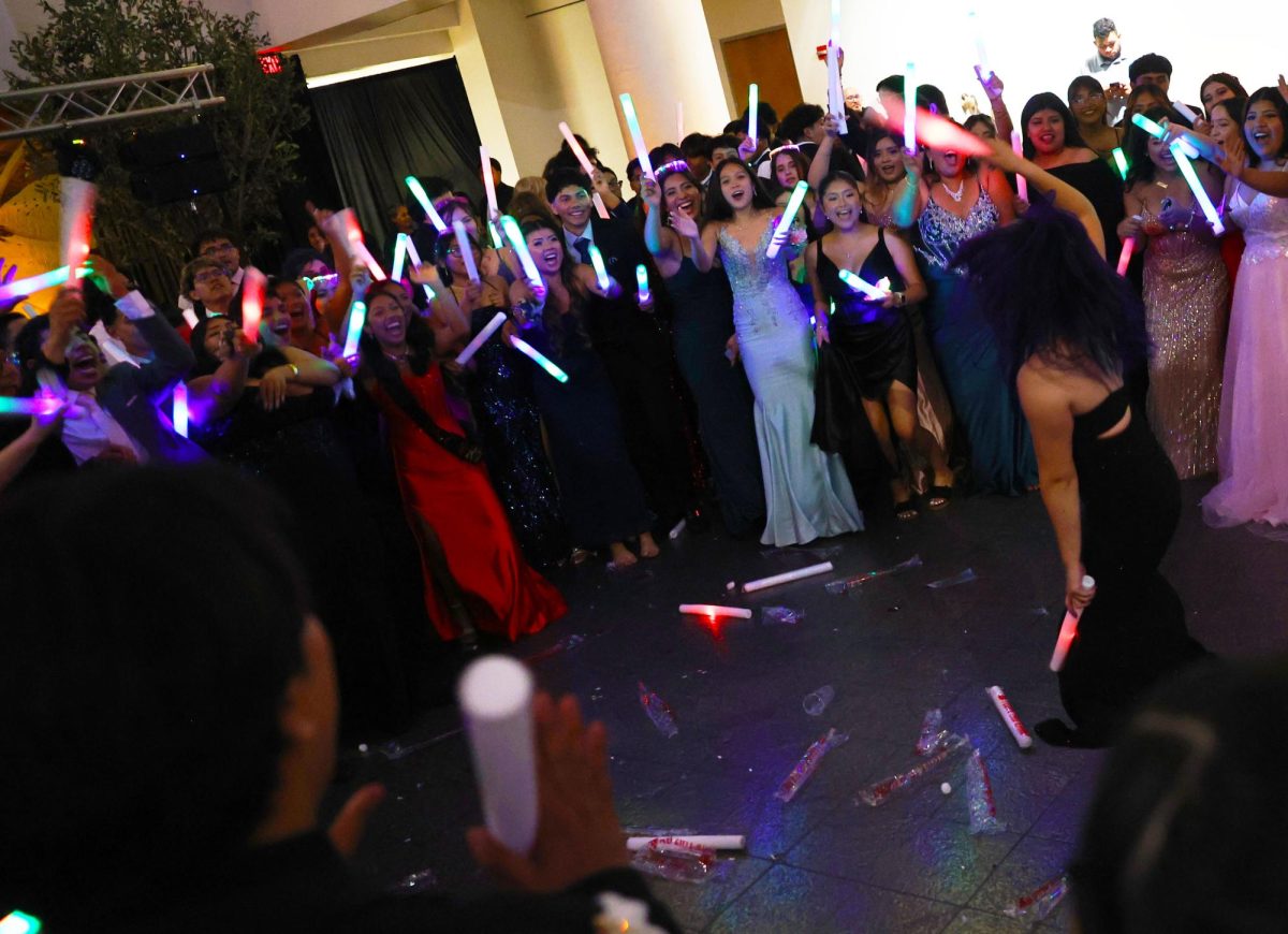 Dancing in a large crowd, students get down during Prom. 