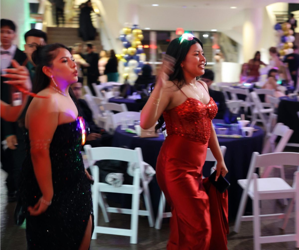 Students head out to the dance floor as their favorite songs play at Prom. 