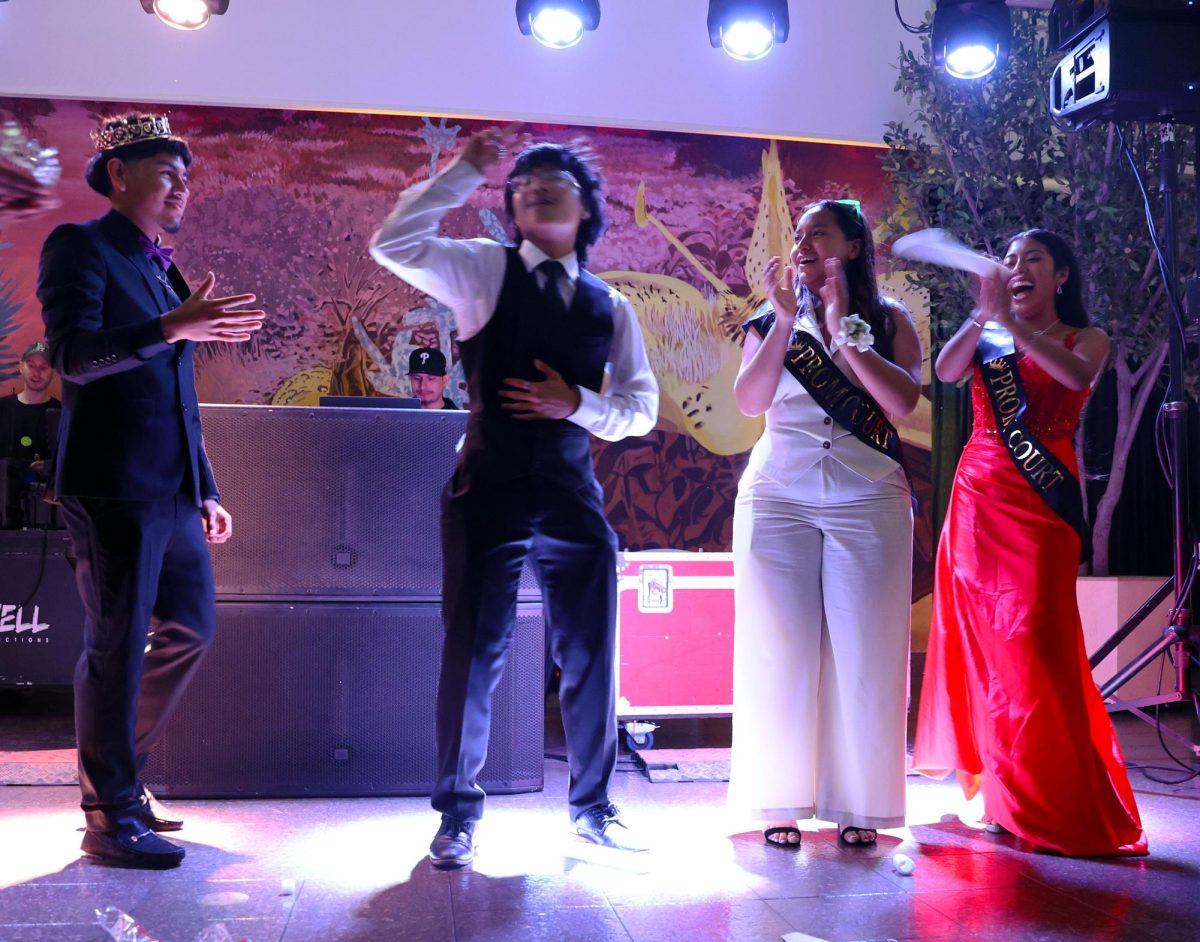 Clark Kent Ibarra cheers along with other members of Prom court. Samuel Aguilar was crowned King and Abril Colin was crowned as Queen. 
