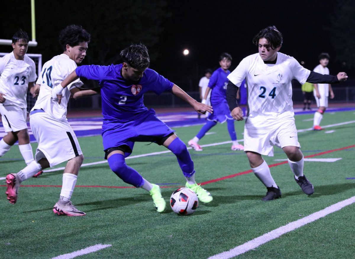 Take the ball! Luis Martinez takes the ball from another player with ease. 