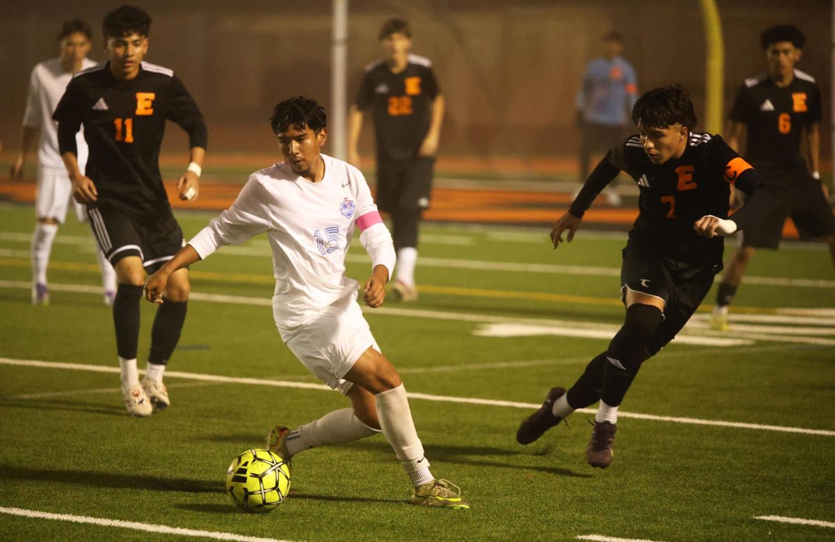 Getting around. Playing the rivalry game against Escondido High school. On December 19, David Rivera, 12, dribbles through his opponents to get away. “I received the ball and tried to find my teammate so he can help me score,” Rivera said. Rivera’s main goal was to find any chance to score to win the game and keep the trophy home. Photo by Amy Ledezma Gonzalez