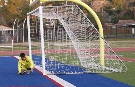 Heads up! Reaching the other side of the field, Emmanuel Salvador, 11, shoots a goal and makes the final and winning score! After Luis Martinez, 11, passed the ball to Salvador, 11, he attempted a kicking shot and successfully ended the game with a win for Orange Glen. “Without that half time meet, I don’t think we would have the confidence to win that game,” Martinez said. The winning goal was scored by Salvador in the final two minutes of the game. Photo by Richie Martinez.