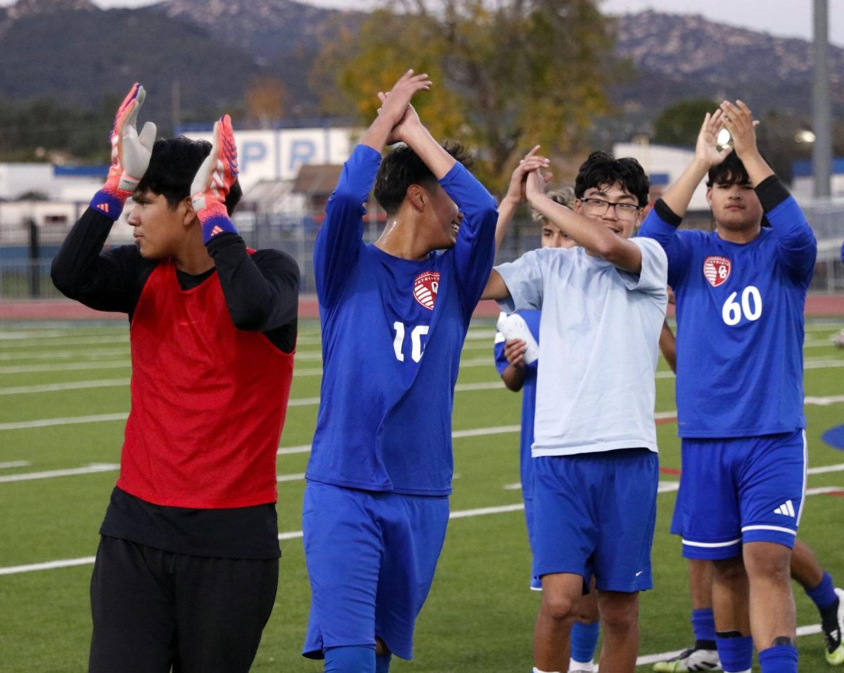 Patriots take over! After the conclusion of an amazing game, JV Soccer Player Luis Martinez, 11, leads the start and end of the high-five line. The game concluded with a win after a final goal was shot by Emmanuel Salvador, 11. The winning goal, scored by Salvador, was not kicked until the final two minutes of the game. “I’m seriously proud of ‘Emmy’ and my teammates for doing a great job and never giving up,” Martinez said. To make the final goal, it took five teammates to pass the ball across the field and score. Photo by Richie Martinez.