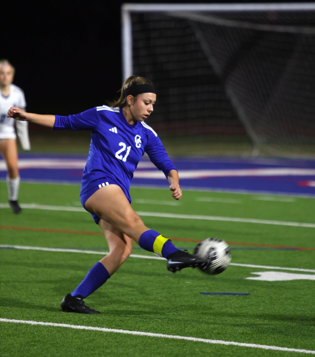 In the zone. With complete attention on the ball, Franchesca Banuelos, 12, attempts to strike the ball into the goal. During the game Banuelos was moved from midfield to center forward. “Being pushed up made me feel like the coach saw that I had the potential to shoot. From mid you don’t need to shoot as much, you just need to control the ball,” Banuelos said. Banuelos said playing Coastal Academy from home added pressure to the game because of their previous win against them. Photo by Kimberly Sosa.